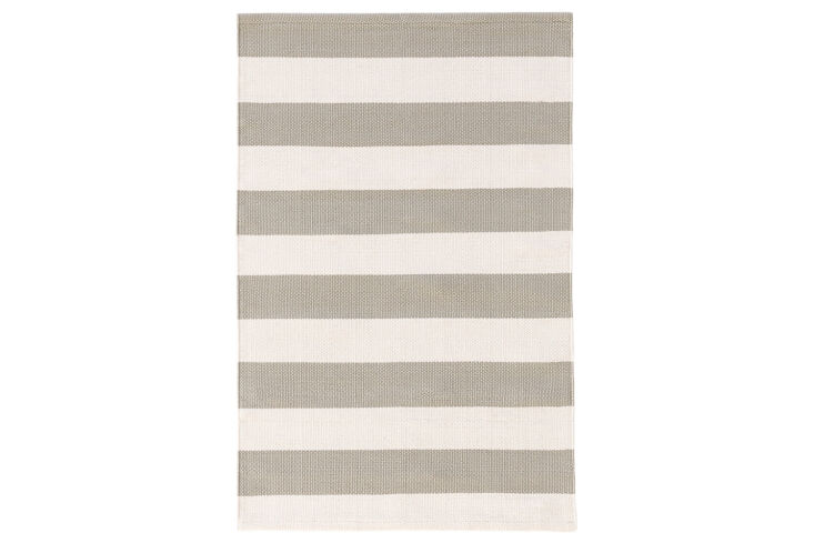 The Catamaran Stripe Indoor-Outdoor Rug in Platinum and Ivory is \$398 for the 5-by-8-inch size at Annie Selke.