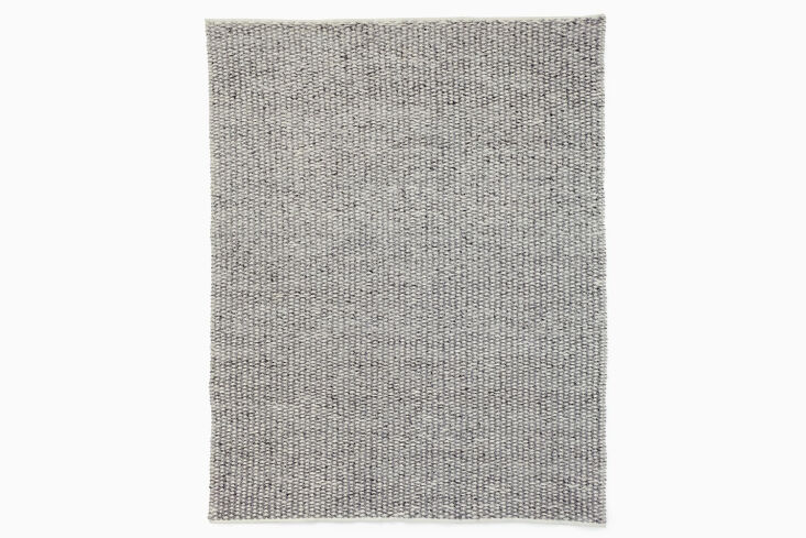 The West Elm Woven Honeycomb Indoor-Outdoor Rug is made of polyester with a wool feel; \$\299 for the 5-by-8 size.