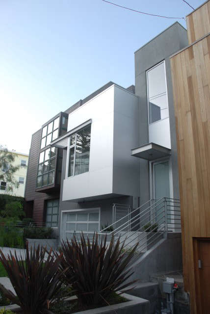 Bernal House: This new, single family home draws in the dramatic rear-of-house San Francisco Downtown views and light while double height spaces enlarge the interior and connectspaces to the outdoors. Green technologies were implemented to reduce consumption and energy use such as sustainable or recycable materials, solar panels, radiant heat and passive cooling.