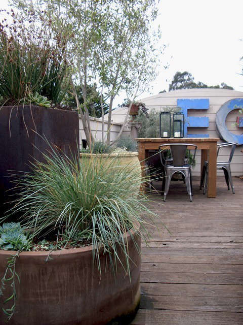  Letters and Grasses and Tigers, Oh My!: This rooftop garden increases the client&#8\2\17;s livable space \2 fold. We were able to incorporate seating, dining and cooking areas but overall it just feels like a getaway much farther away than just pstairs&#8\230;. Photo: Beth Mullins