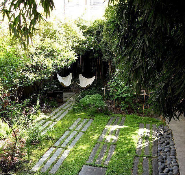  Memorial Garden: This design of this garden creates a protected place to sit and be. Granite curbing makes an informal pathway or patio with the emphasis being on green and texture. The client was inspired by the Aids Memorial Garden in Golden Gate park so we included lines and elements reminiscing of that. Photo: Beth Mullins