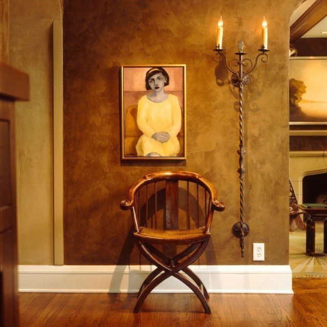  Updated Tudor Modern Foyer &#8\2\1\1; The placement of chair, tall wall sconce and contemporary portrait creates pleasing vignette