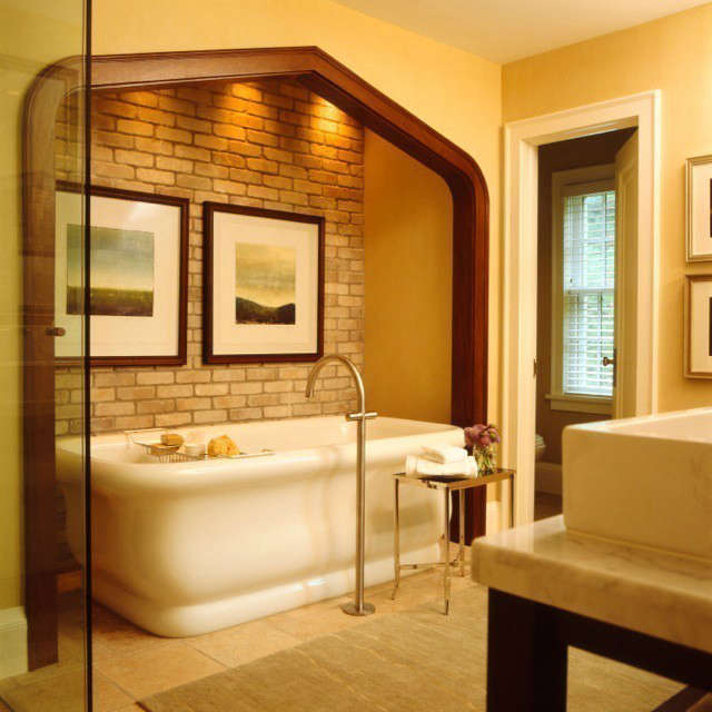  Updated Tudor Modern Master Bath &#8\2\1\1; The placement of this deep curvaceous bathtub in an alcove creates a spa like experience
