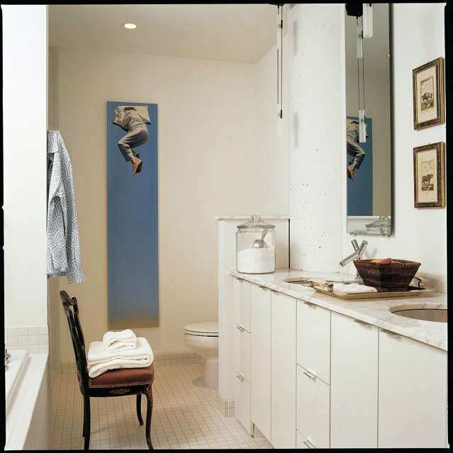  White Loft Master Bath &#8\2\1\1; The whimsical vertical painting creates a focal point in this all white bathroom.