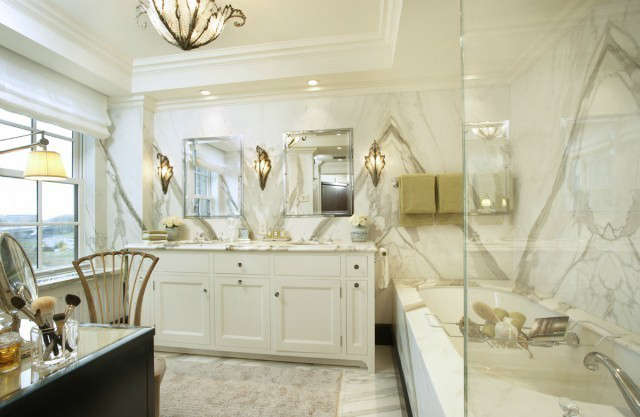  Uptown Apartment Traditional Master Bathroom &#8\2\1\1; The walls and floor of this beautiful bathroom are clad in slabs of Calcutta Gold marble.