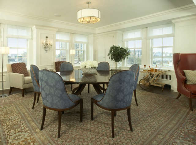  Uptown Apartment Traditional Dining Room &#8\2\1\1; A round table that expands to seat ten makes great use of this square shaped dining room.