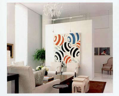  White Loft Modern Living Room: The &#8\2\20;pop&#8\2\2\1; of colorful art defines and enlivens the living area in an all white loft.