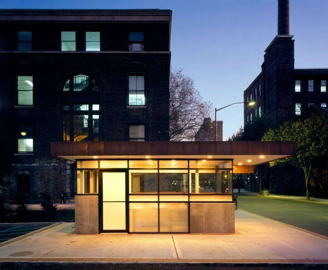  Pratt Security Booth: A cast in place concrete base is seperated from the copper roof by a modulated storefront of aluminum and glass.This small building designates the entry to the historic Brooklyn campus. The structure is composed of a folded copper roof plane, providing enclosure for a simple volume of concrete and glass. The materials are derived from an understanding of context. This project has been selected for architecture exhibits throughout the Americas. Photo: Ty Cole.