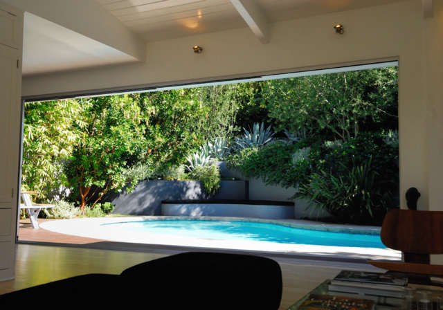  Silver Lake Residence: Pool lanaiA large sliding door provides access to the swimming pool garden. The frame creates a three-dimensional landscape design picture. Photo: Russ Cletta