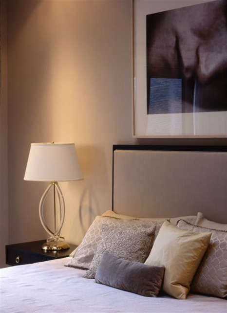 Park Avenue Bedroom &#8\2\1\1; A Sam Samore Photograph hangs over a custom designed head board. Lamp and bedside table are vintage.