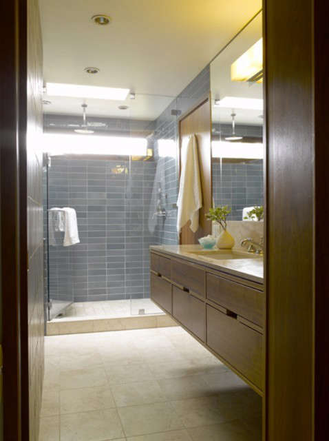  Seward Park Bath: The powder and master baths are combined in one larger space that allows for closing off the toilet and a sink for use by guests. Space was maximized by capturing an adjoining closet and eliminating the second toilet. The idea was to make both sides of the bathroom work well separately and together. Photo: Alex Hayden