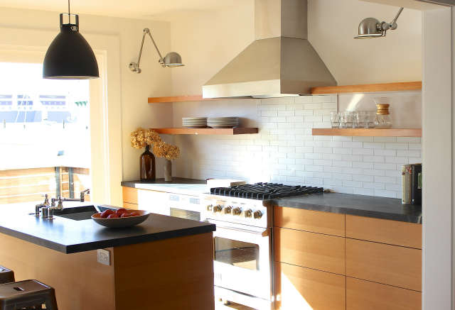  San Francisco Condo &#8\2\1\1; Kitchen Renovation: Industrial French lights, Douglas fir cabinets, soapstone countertops, and Heath tile backsplash give this kitchen a modern, yet warm, feel. A new sliding door and patio link the space to the outdoors.