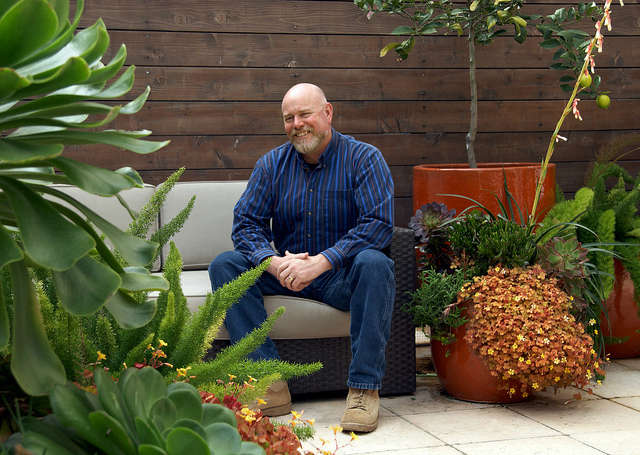  Urban container garden: Patrick Lannan sits amid an urban container garden he designed for a San Francisco apartment. Photo: Caitlin Atkinson
