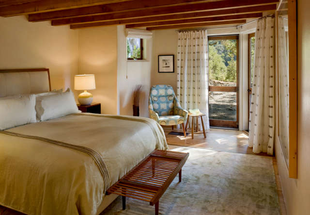  Big Sur Cabin Bedroom &#8\2\1\1; An earth tone palette and simple linens were chosen for a comfortable, informal interior. View on our website