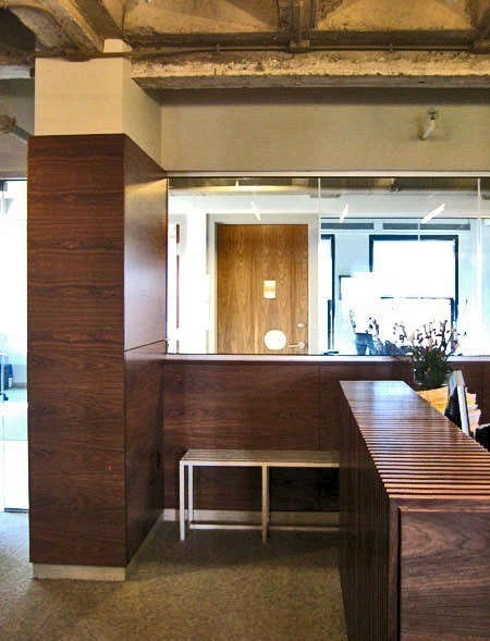  Spark Capital, Boston, MA: When Spark came to us with space in a very &#8\2\20;proper&#8\2\2\1; Newbury Street building—ornate lobby, gilt wood elevator cabs—they asked if we could create a space that looked like an industrial loft. The project became more about demolition than addition. Once the finishes from the last tenant were removed, we were left with concrete ceilings and floors, and exposed systems. We added back the essentials that would make the office function, much of it in walnut, a counterpoint to the otherwise raw space.