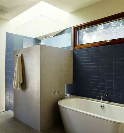  Winebaum Residence &#8\2\1\1; Blue tile walls with natural lighting from skylight over shower. Clerestory windows over tub provide more light to bathroom.