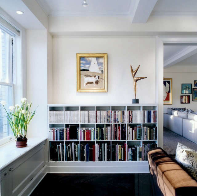  Pre-War Apartment, Living Room bookcases: A custom bookcase with modern proportions mixes into a pre-war apartment. This bookcase design was repeated throughout the apartment to unify the whole scheme. Photo: Karen Cipolla