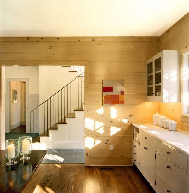  Weekend House, Kitchen, Norfolk, CT: New construction for a weekend house in Connecticut. The kitchen walls are clad with horizontal butt-jointed pine boards. The artwork is by Joe Fyfe. Photo: Karen Cipolla