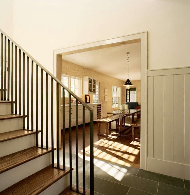  Weekend House, Norfolk, CT: Double height entry foyer with a stair leading to the second floor. The custom steel handrail wraps the landing above. Photo: Karen Cipolla