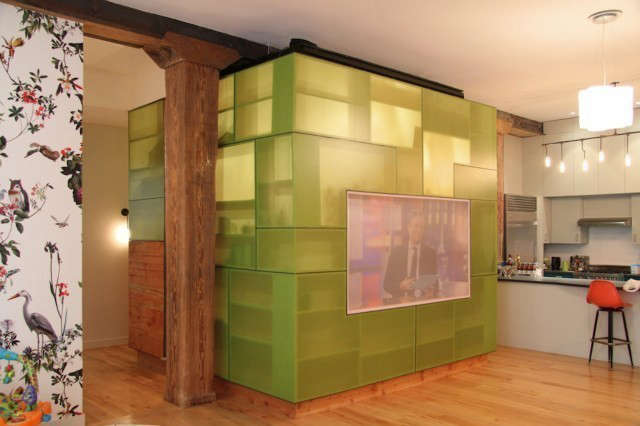  Horatio Street Loft: A loft in the West Village transforms an old stable into a unique living space. Almost a square, the entire loft was designed around a media library seen here as a transluscent cube. This intimate library space serves to contrast and balance the capaciousness of the loft. Photo: Eric Lifting