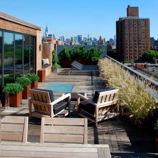  Eldridge Street Roof: A complete roof-deck makeover combines views and privacy in Manhattan&#8\2\17;s Lower East Side. A cantilevered steel stair, sheltered in a wood planked bulkhead connects the original apartment to the deck. Finished in sustainably harvested ipe, the deck environment integrates plantings, outdoor showering, and dining areas as well as concealed storage. The deck terminates at its north end in a screen of blue-grey concrete fiber board underscoring views on the city skyline.