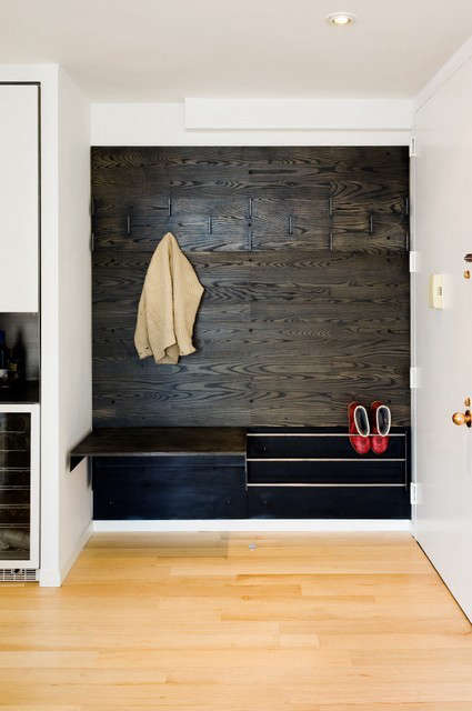  Storage Wall: In a small Manhattan penthouse, a small, detailed, millwork piece made of oak, steel, and rubber provides some extra storage and utility.