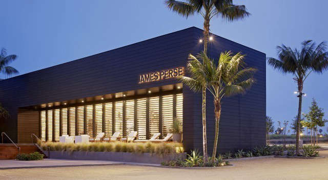  James Perse Malibu: Originally the timber storage warehouse on the site, the James Perse Malibu store features exterior black stained siding, contrasted with the warmly illuminated white interior. Tall painted oak cabinetry, reclaimed teak flooring and exposed wood ceiling add to the beach house atmosphere of the space. Photo: Joe Fletcher and Marmol Radziner