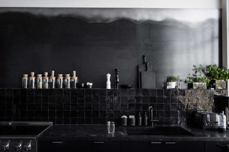 black zellige tile as a backsplash in one of our favorite dark and moody kitche 24