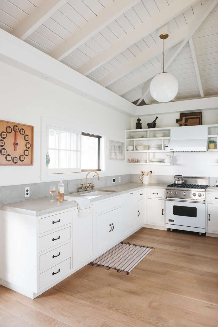 A Viking range fits with the white color scheme in A Vintage Hawaiian Cottage Restored (with Its Own Instagram Account).