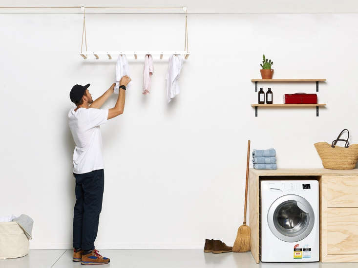 The George and Willy Laundry drying rack operates on a pulley: the rack can be raised to dry clothes amid the hot air. Ideal for small-space living.