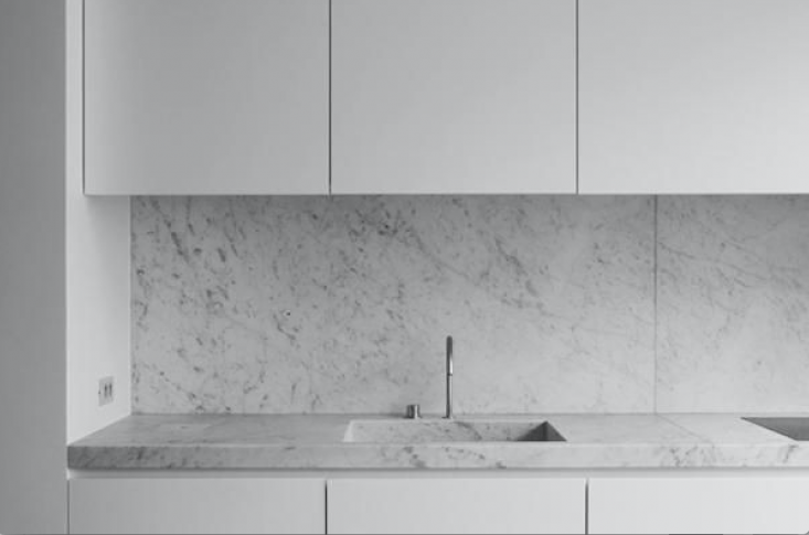 A Carrara marble counter—and integrated sink—in the JR Loft in Brussels by Nicolas Schuybroek. See more at Trend Alert: 14 Integrated Marble Kitchen Sinks.