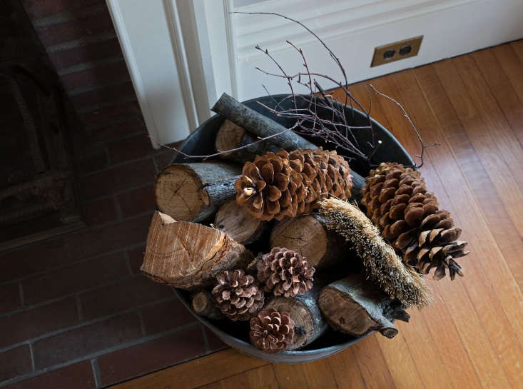 A vintage galvanized tub, which has always served as my log holder, received a holiday treatment with the addition of a few festive pinecones, foraged in Maine and California.