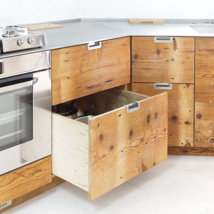 Wood drawers in an Italian kitchen made of reclaimed larch wood
