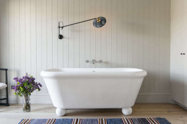 A modern freestanding tub in A Brooklyn Townhouse Reinvention from Elizabeth Roberts. (For more on the bath, see Retro Bath Fixtures from the Water Monopoly.) Photograph by Dustin Aksland.