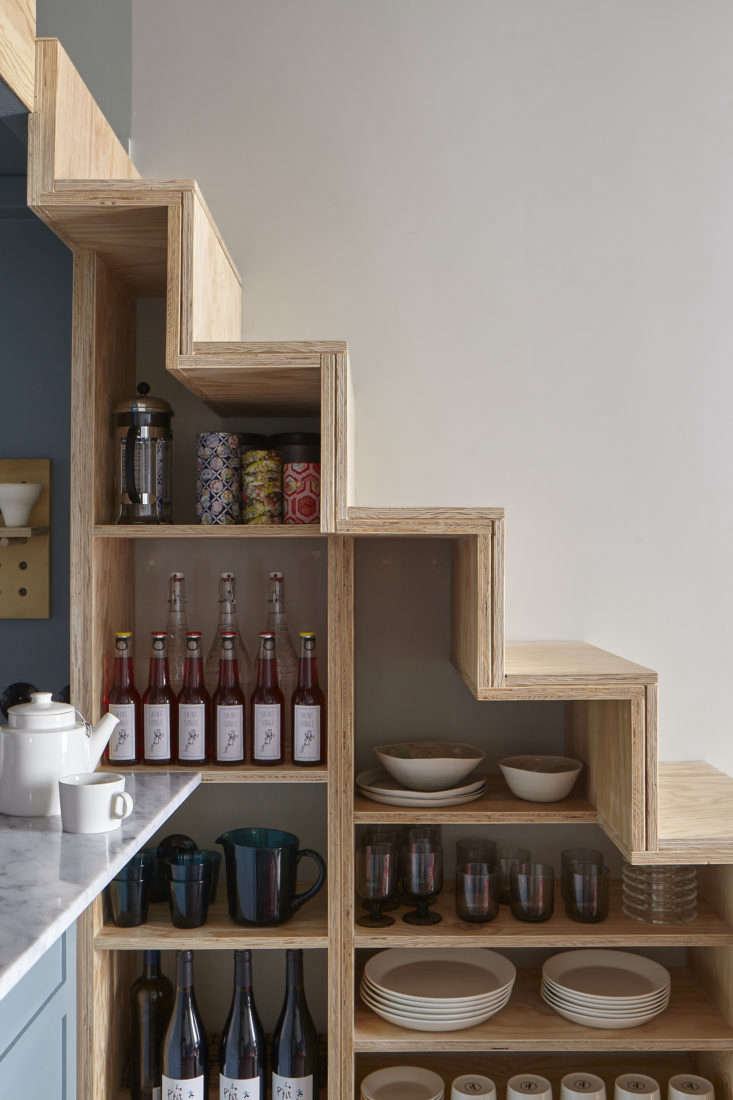 Staircase Shelving in Tiny Paris Apartment by Marianne Evennou