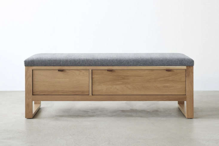 At Unison Home, the Fulton Charcoal Storage Bench is made of solid white oak with an upholstered seat; $1,599.