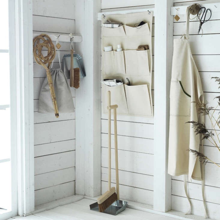 The products in the Borstad line are all made from natural materials such as hardwood, cedar, metal, rattan and canvas. From left: a rattan Carpet Beater ($5.99), a linen Shoe Bag ($4.99), a Dust Pan and Brush ($12.99), a Hanging Organizer ($12.99), a standing Dust Pan and Broom, ($19.99), and an Apron ($9.99).