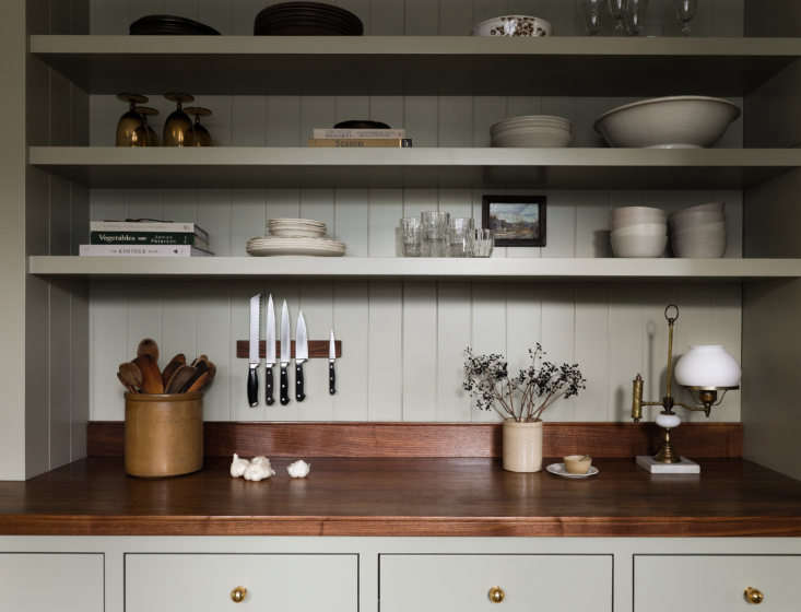 English-style galley kitchen in Seattle designed by Heidi Caillier.