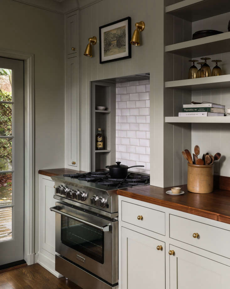 English-style galley kitchen in Seattle designed by Heidi Caillier.