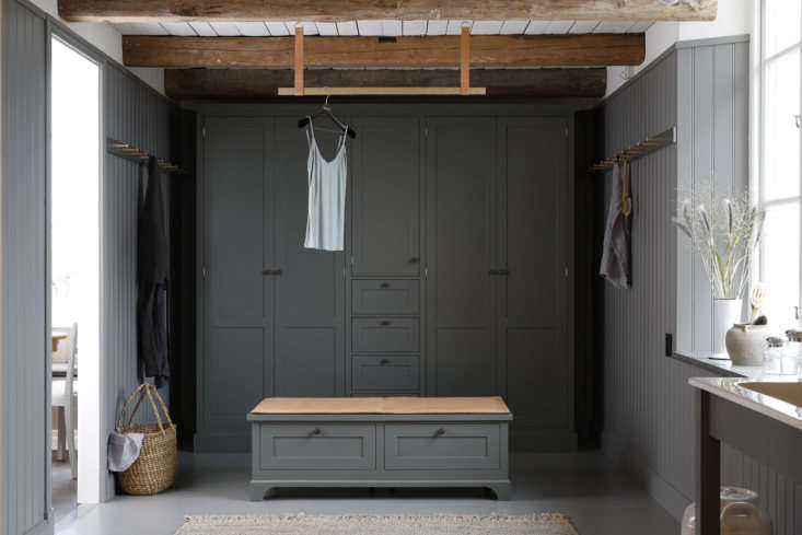 Wood paneled dressing room with built-ins by Kvanum of Sweden.