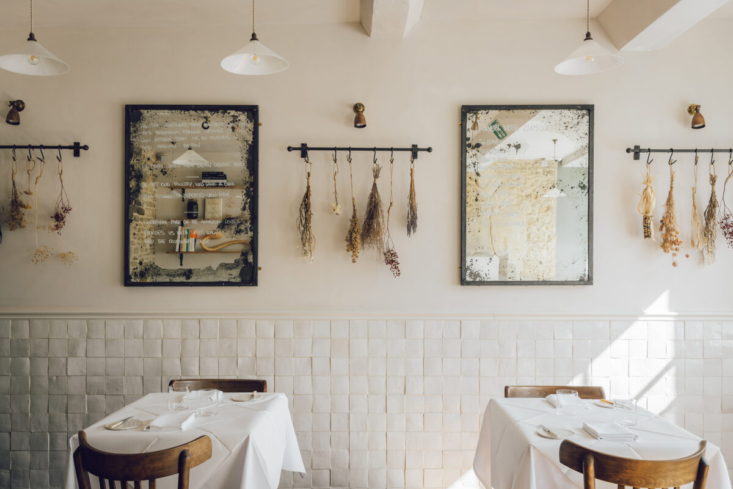 Sure, the wall of No.\1 Bruton Restaurant would have looked great with traditional subway tiles, but handmade Zellige tiles take it to the next level. Photograph courtesy of The Modern House, from Steal This Look: A Timeless Dining Room in Somerset.