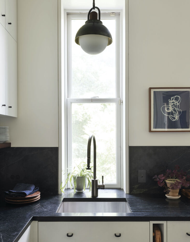 Current Obsessions Upcycled Finds Black soapstone counter in architect Elizabeth Roberts' own Brooklyn kitchen remodel.