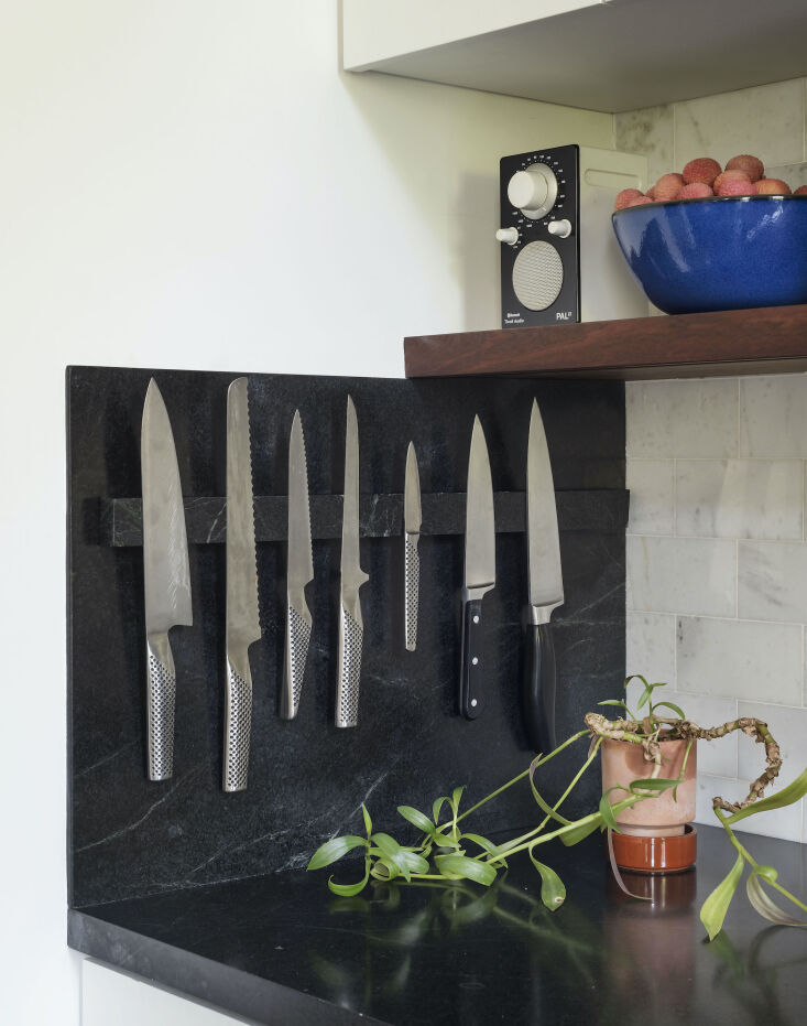 Current Obsessions Upcycled Finds Black soap stone with magnetic knife storage in architect Elizabeth Roberts' own Brooklyn kitchen remodel.