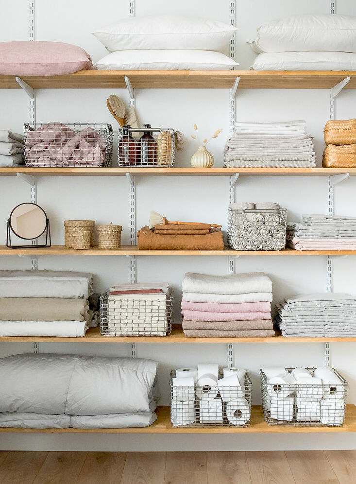 Linen closet goals: shelves with Korbo metal baskets.