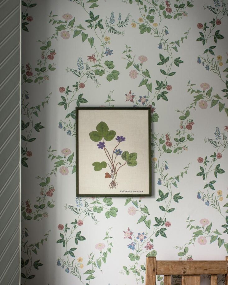 Midsummer Eve, also available in a charcoal background, evokes the Swedish tradition of placing flowers under your pillow to dream of your future love.  Scroll down to see it in a cottage bedroom.