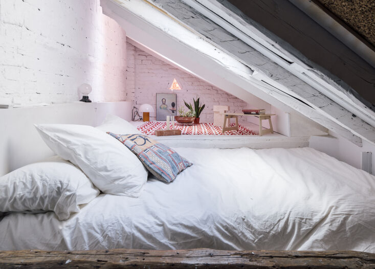 Loft bedroom in architect Mariana de Delás-designed Madrid apartment, a project known as The House for Cosimo Piovasco.