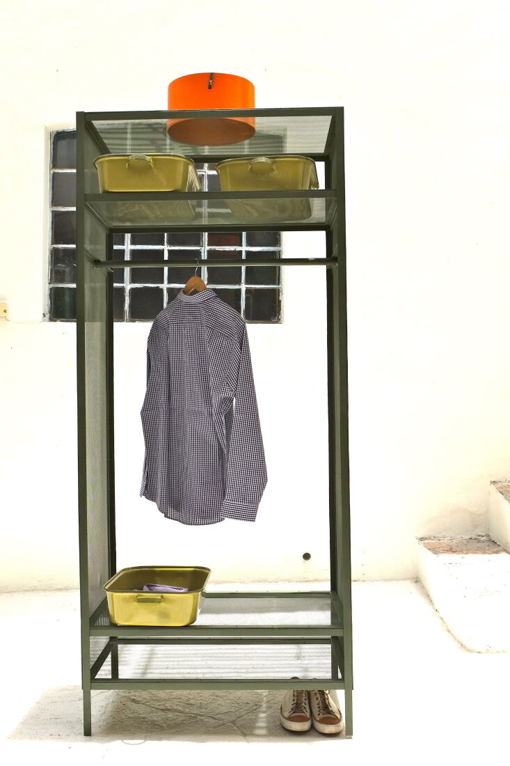 Casamidy wardrobe with metal kitchen pans as shirt bins.