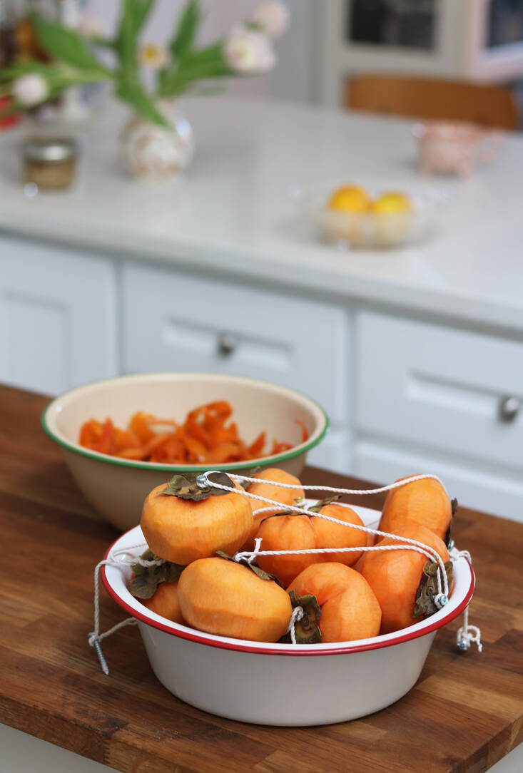 Another persimmon idea, this one from Marie, over on Gardenista: dried persimmons, called hoshigaki, make a vibrant hanging display that, once finished, makes a jammy and tender delicacy. See Hoshigaki: Persimmons, Transformed.