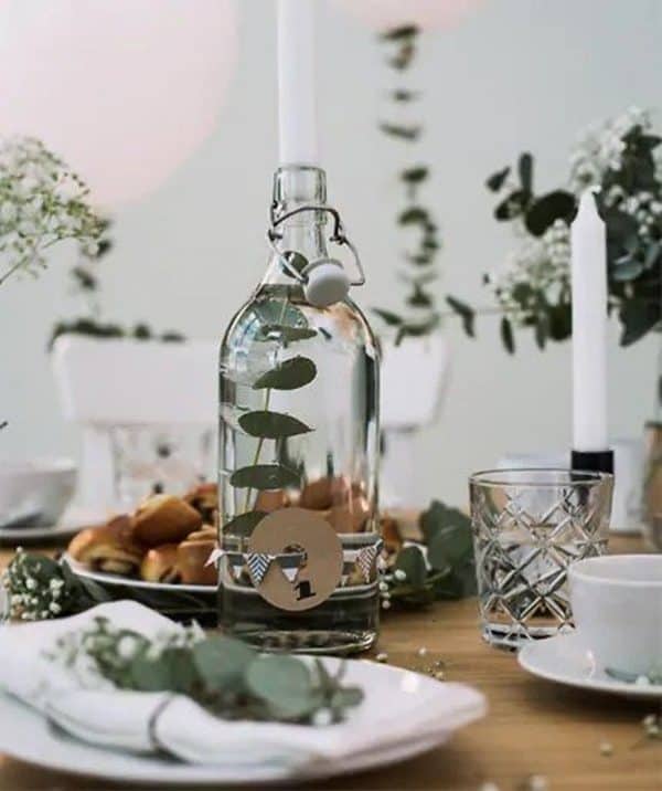 I love this idea from Ikea Germany: bottle as elegant candleholder. Shown is their Korken Bottle (\$3.99) with a stem of eucalyptus, though in the spirit of no-cost, upcycled decor, a clean wine or olive oil bottle would be equally beautiful.
