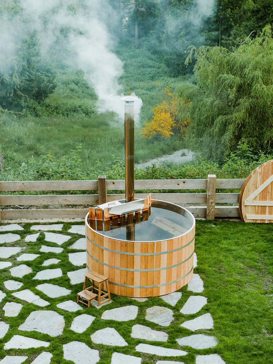 The AlumiTub Wood-Fired Hot Tub is made of Canadian Western Red Cedar and a marine-grade aluminum firebox; \$7,995 CAD.